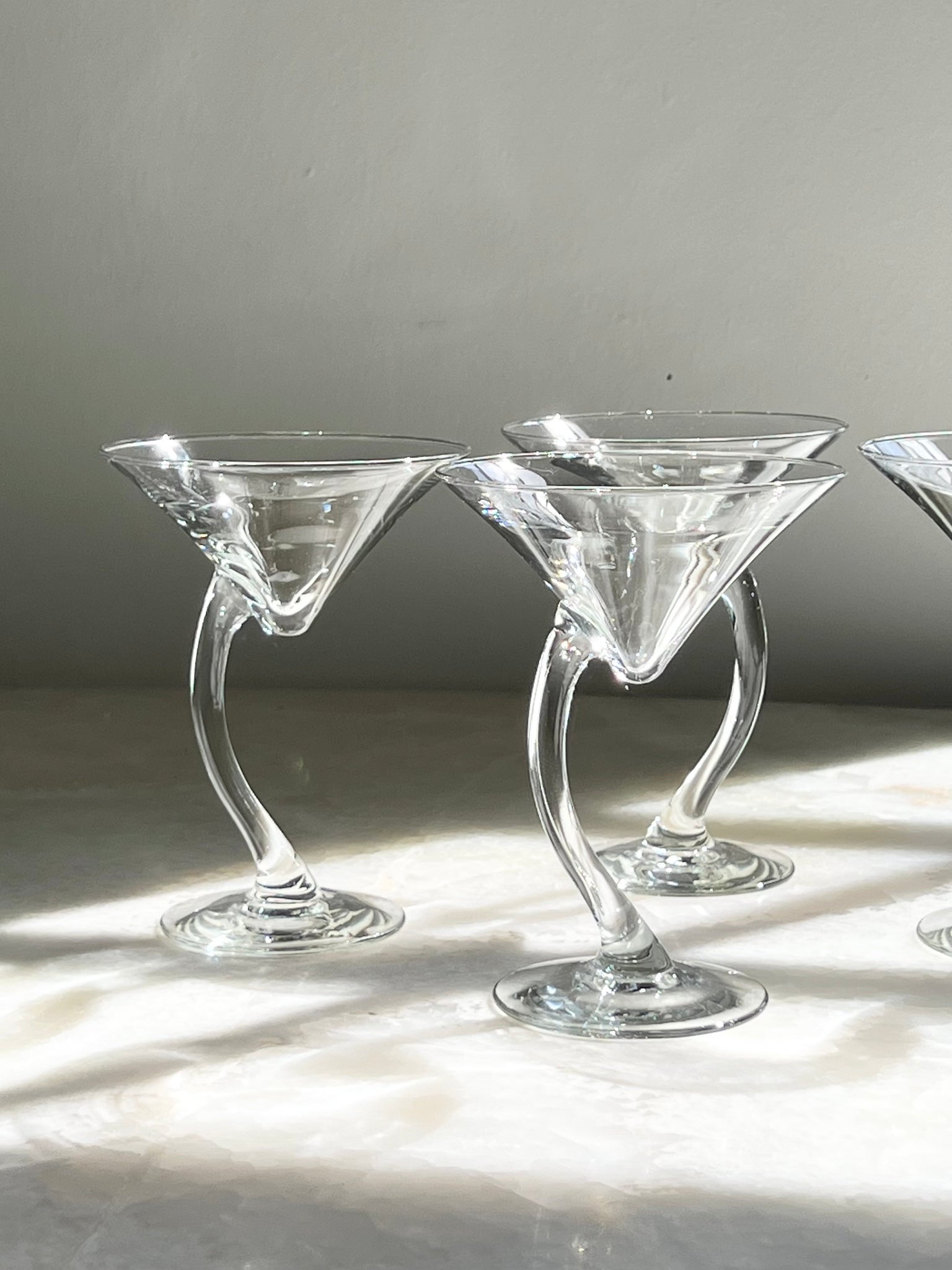 Curved martini glasses